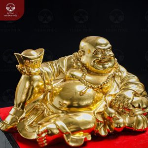Giá trị phong thủy của tượng Phật Di Lặc cầm thỏi vàng